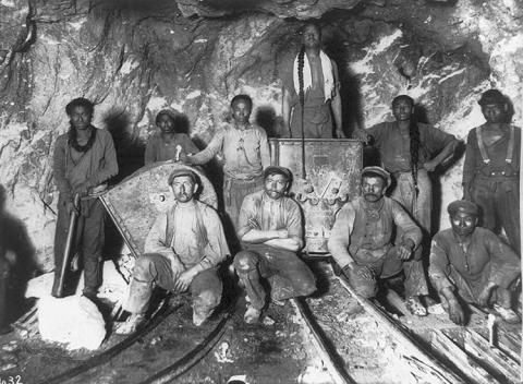 Black, Chinese and White laborers in a gold mine in South Africa