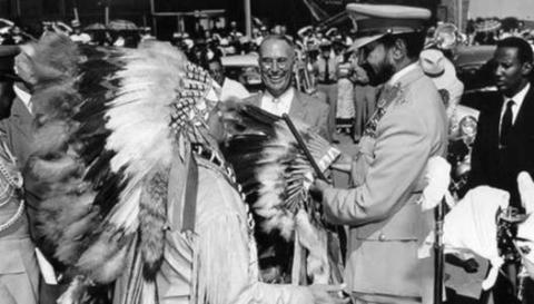 Haile Salassie recieves bonnet from Acee Blue Eagle - Oaklahoma June 18, 1954